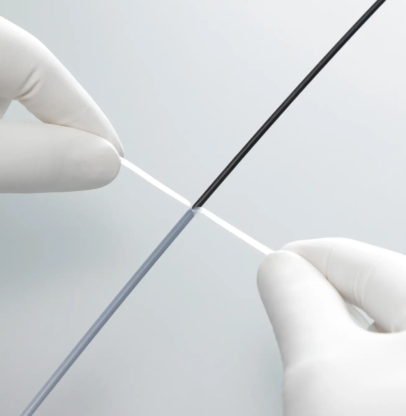 Peeling Junkosha ITP-01 heat shrink tubing from catheter — hand peel, zero blade contact
